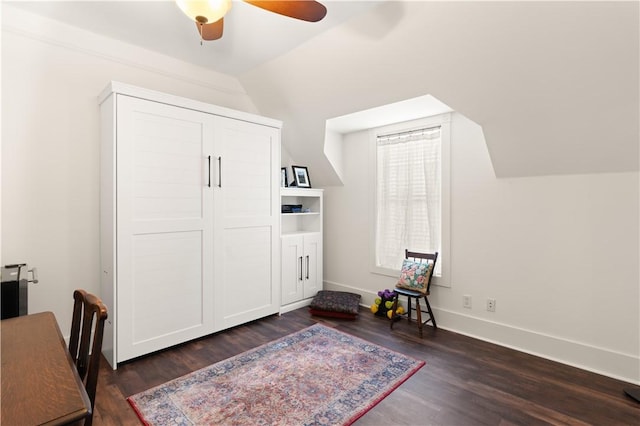 office area with baseboards, dark wood-style flooring, and ceiling fan