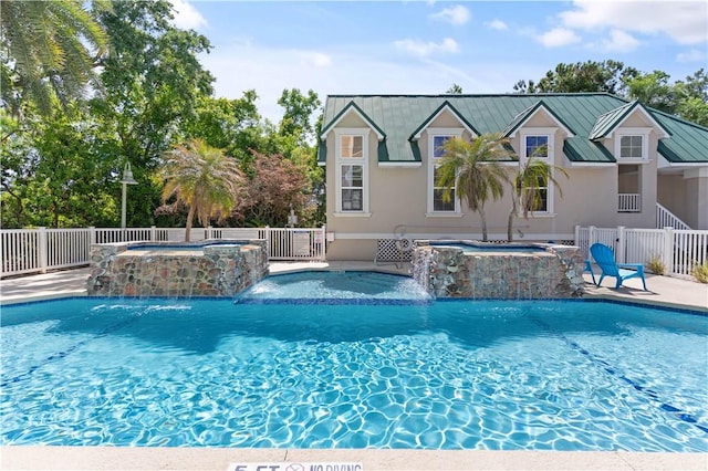 view of pool featuring fence, an in ground hot tub, a fenced in pool, and a patio area