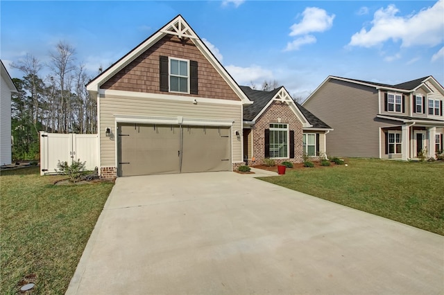 craftsman-style home featuring brick siding, fence, concrete driveway, and a front yard