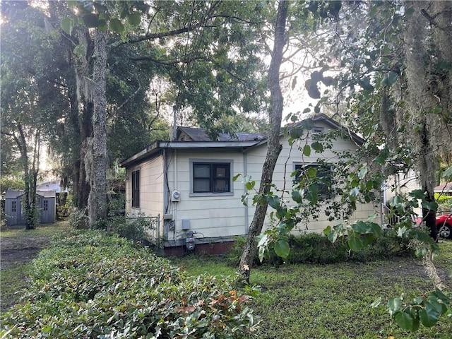 exterior space featuring a shed