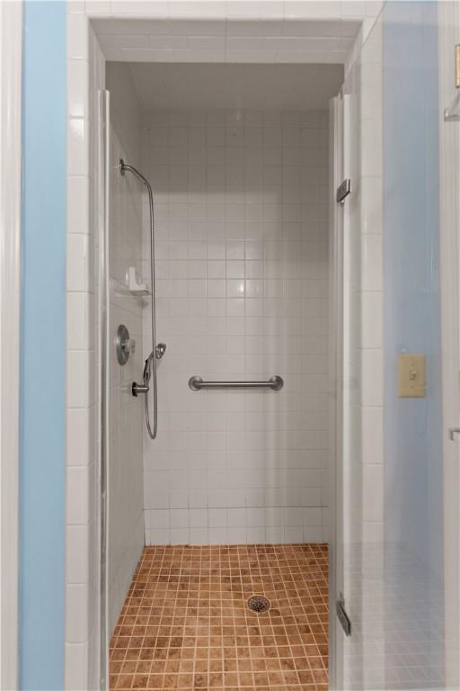 bathroom with tiled shower