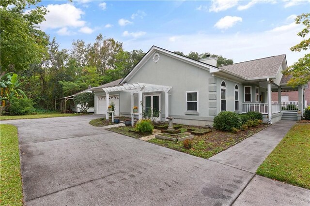 view of front of home featuring covered porch and a garage