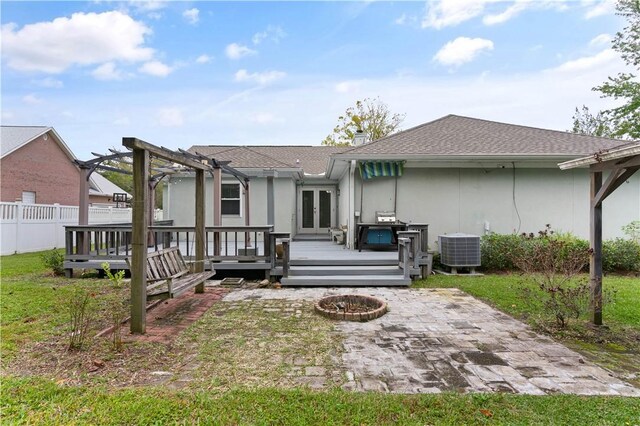 back of house featuring french doors, a pergola, a deck, central AC, and a fire pit