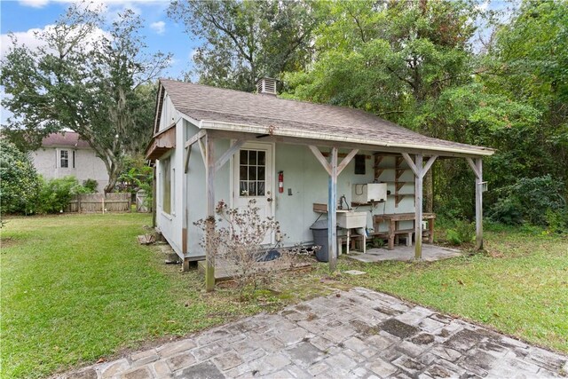 view of outdoor structure with a lawn