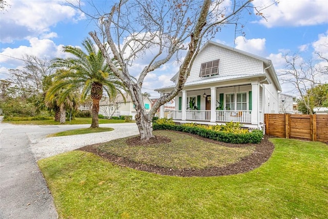 view of front of house featuring a porch and a front lawn