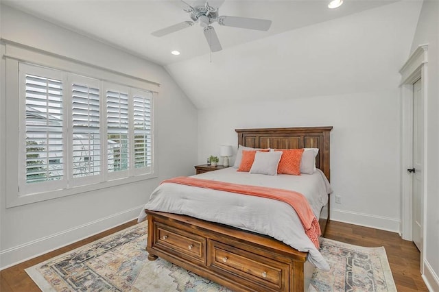 bedroom with dark hardwood / wood-style floors, ceiling fan, and lofted ceiling