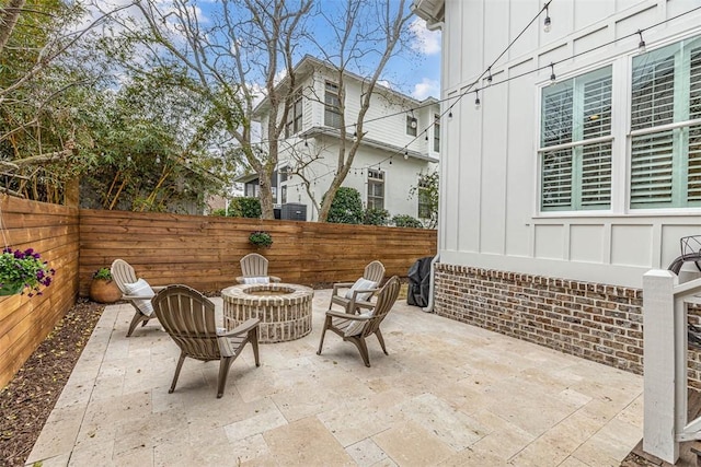 view of patio / terrace featuring an outdoor fire pit