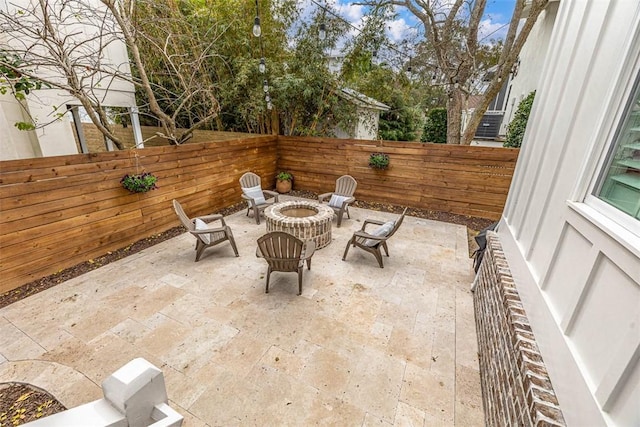 view of patio / terrace with an outdoor fire pit