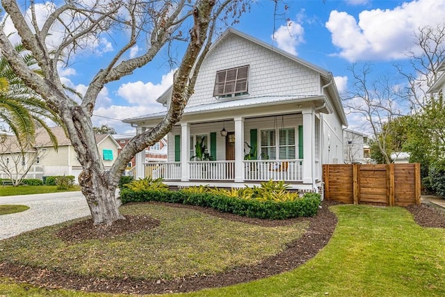 view of front facade with a front yard and a porch