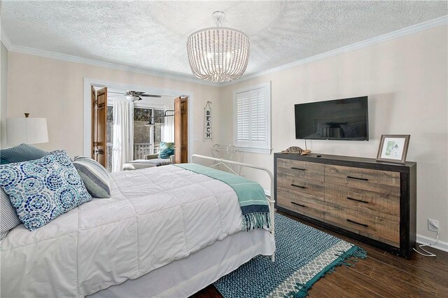 bedroom with crown molding, dark wood-type flooring, a textured ceiling, and a notable chandelier