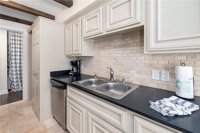 kitchen with tasteful backsplash, dishwasher, beamed ceiling, and sink