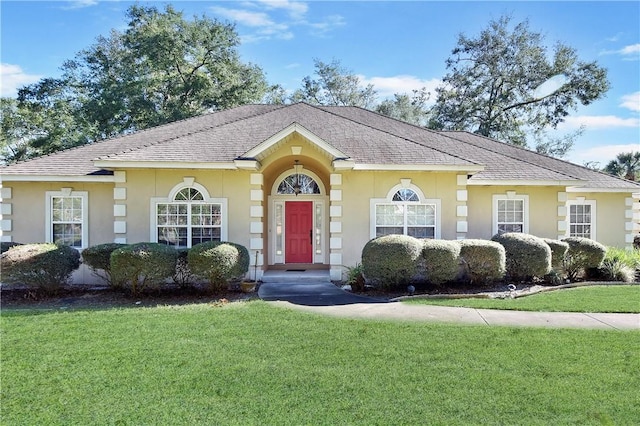 single story home with a front yard