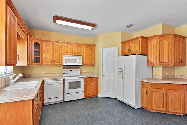 kitchen with white appliances and sink