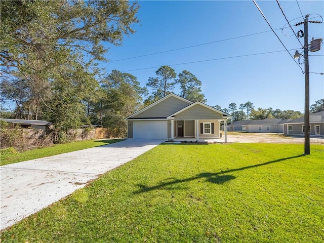 view of front of home featuring a front yard and a garage