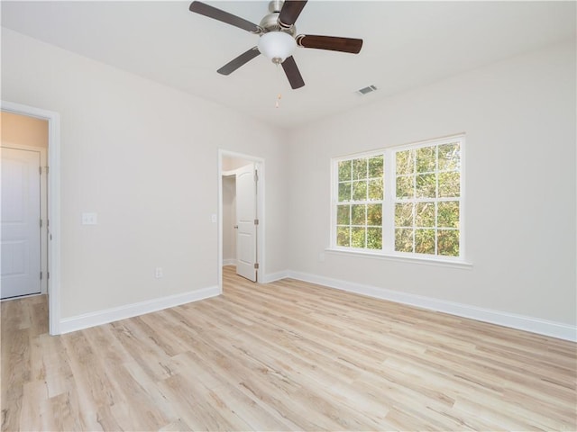 spare room with ceiling fan and light hardwood / wood-style flooring