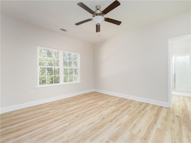 empty room featuring ceiling fan and light hardwood / wood-style flooring