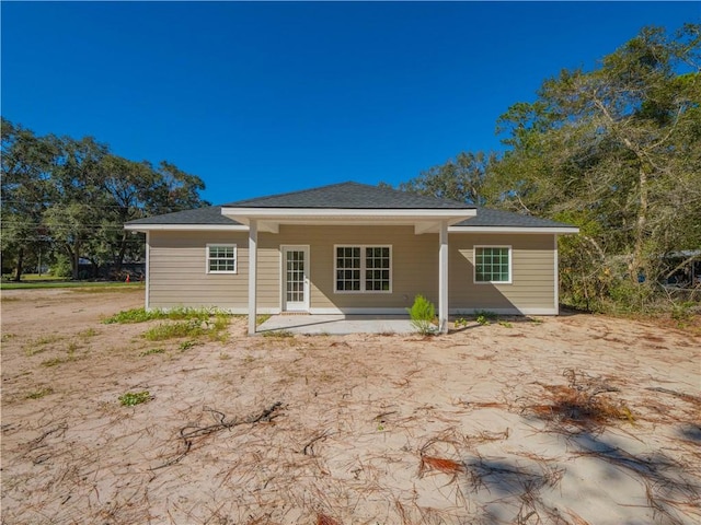 back of property featuring a patio