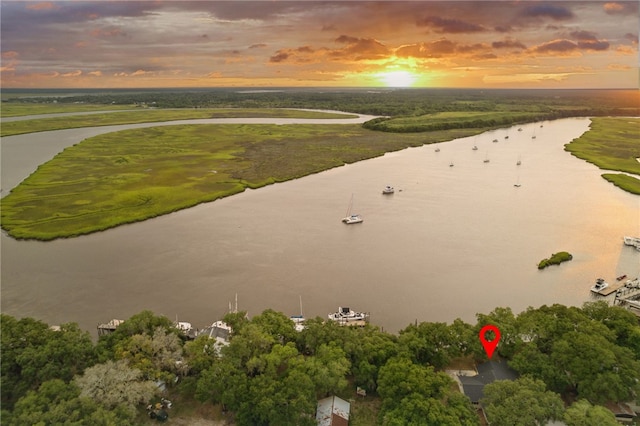 aerial view at dusk with a water view