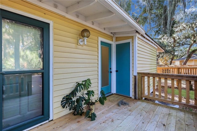 doorway to property with a deck