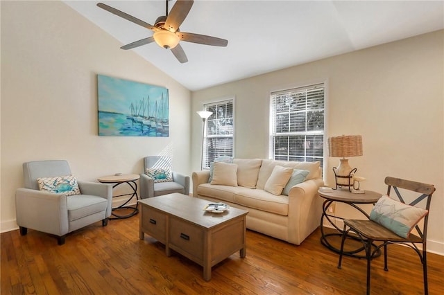 living room with ceiling fan, wood-type flooring, and lofted ceiling