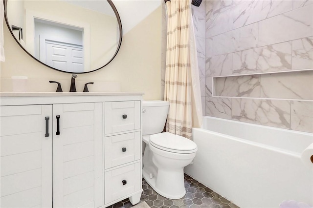 full bathroom featuring shower / bath combo, vanity, and toilet