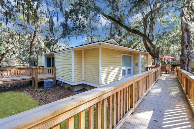 view of property exterior featuring a deck