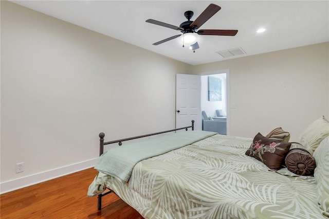 bedroom featuring hardwood / wood-style floors and ceiling fan