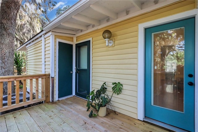 property entrance with a deck