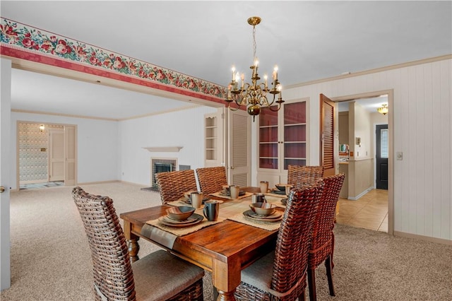 1001 Coral Rd, Waycross, GA 31501 - dining area with a chandelier, light colored carpet, a fireplace, and baseboards