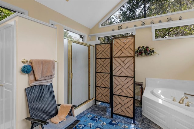 1001 Coral Rd, Waycross, GA 31501 - full bathroom with a shower stall, a bath, vaulted ceiling, and tile patterned floors