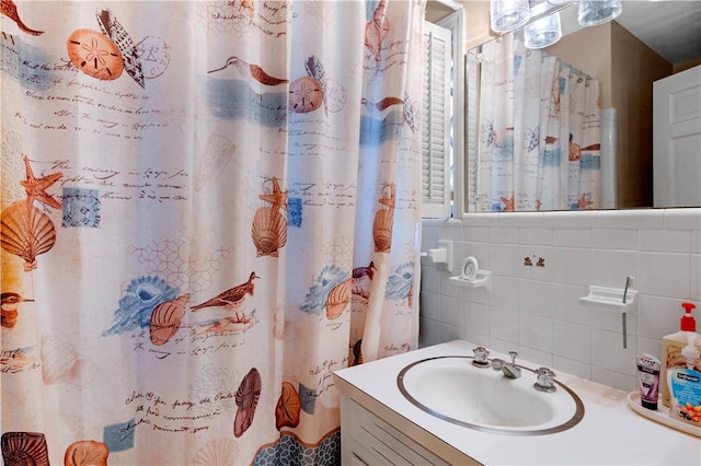 1001 Coral Rd, Waycross, GA 31501 - full bathroom featuring vanity, tasteful backsplash, a shower with curtain, and tile walls