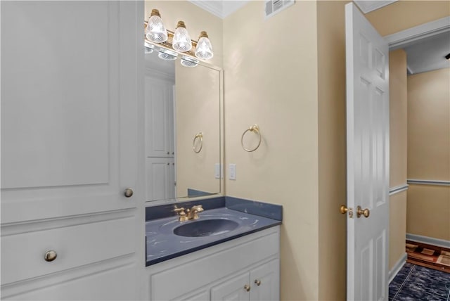 1001 Coral Rd, Waycross, GA 31501 - bathroom with vanity, ornamental molding, and baseboards
