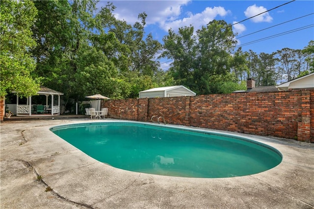 1001 Coral Rd, Waycross, GA 31501 - view of swimming pool featuring a gazebo, a fenced backyard, and a patio area