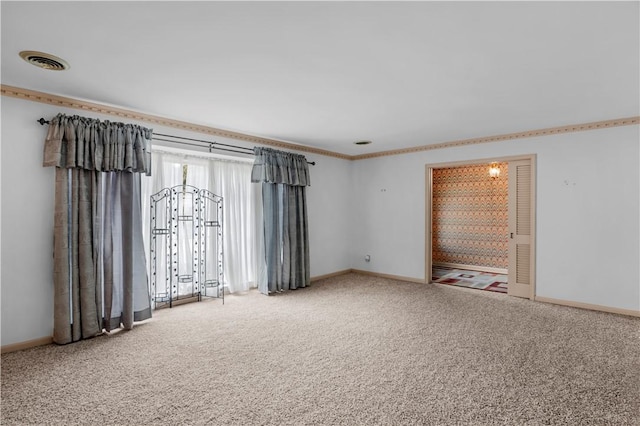 1001 Coral Rd, Waycross, GA 31501 - carpeted spare room with crown molding and baseboards