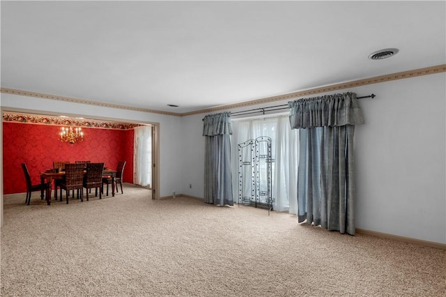 1001 Coral Rd, Waycross, GA 31501 - carpeted dining space with a chandelier, ornamental molding, and baseboards