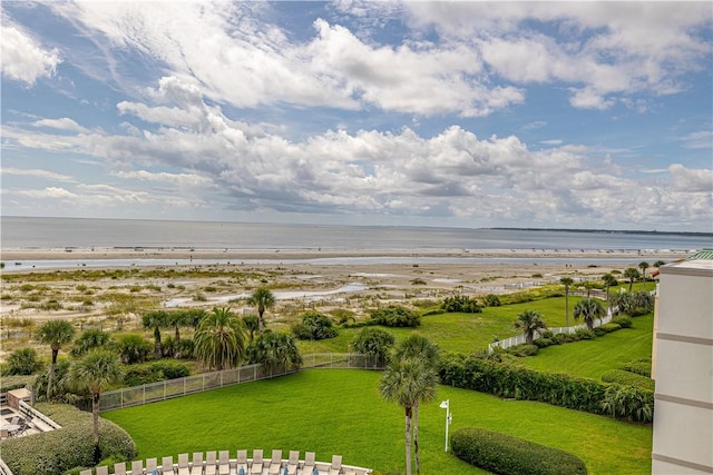 property view of water with a beach view and fence