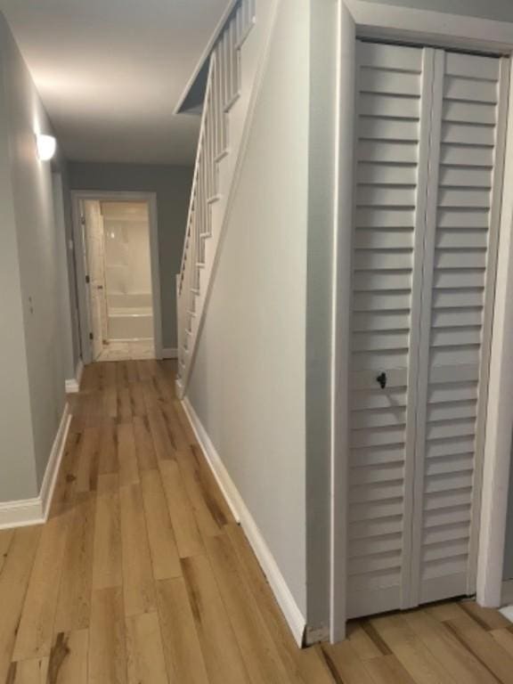 corridor featuring light hardwood / wood-style floors