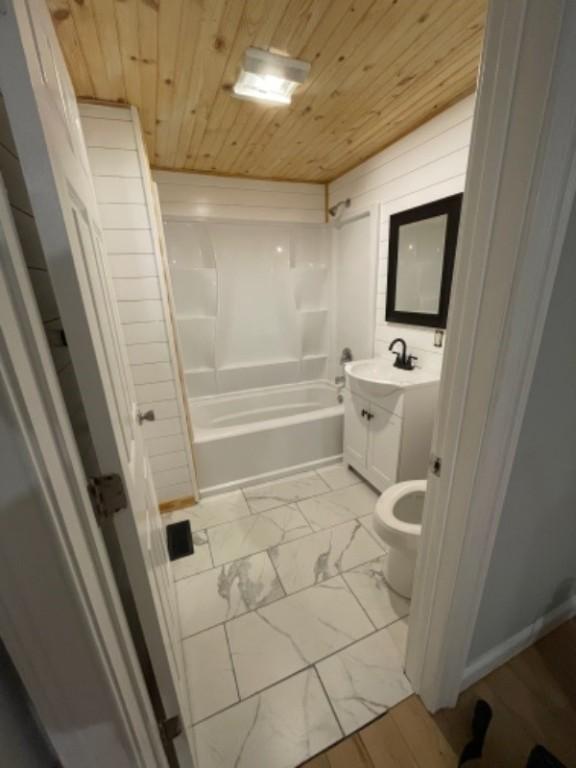 full bathroom with washtub / shower combination, toilet, wood ceiling, and vanity