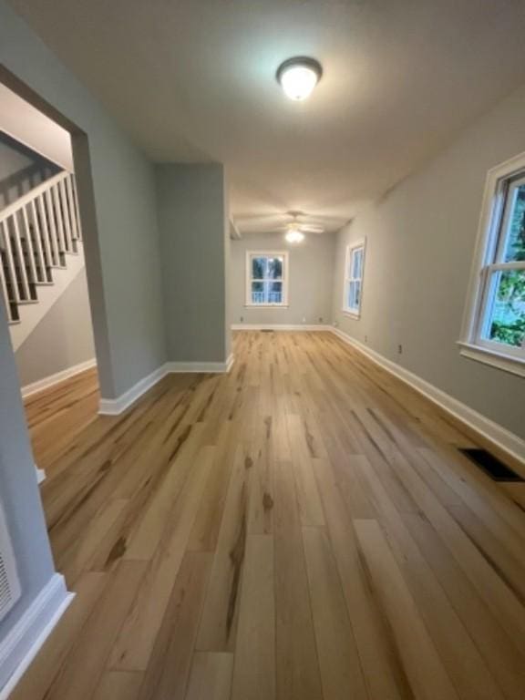 interior space featuring light wood-type flooring and ceiling fan