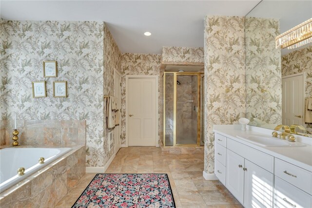 bathroom featuring shower with separate bathtub and vanity