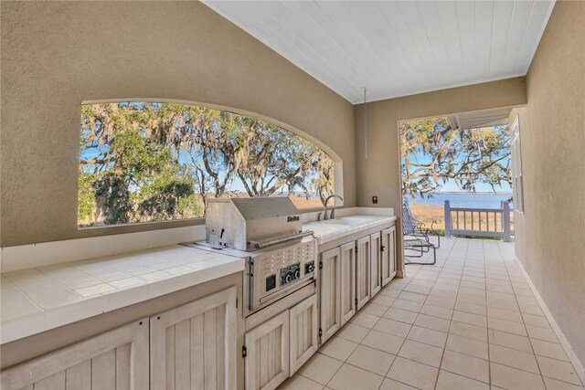 view of patio featuring area for grilling, grilling area, and sink