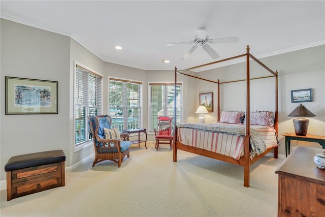 carpeted bedroom with ceiling fan and crown molding