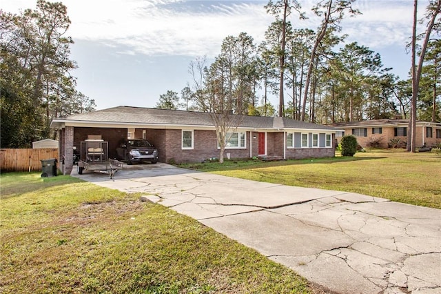 single story home featuring a carport and a front lawn