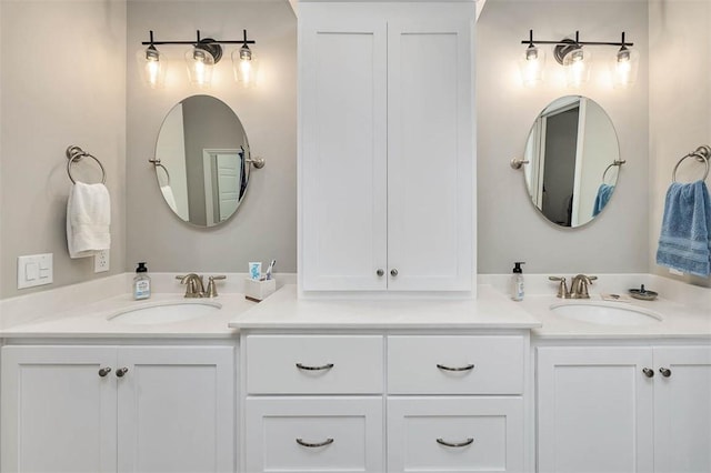 full bathroom featuring a sink and double vanity