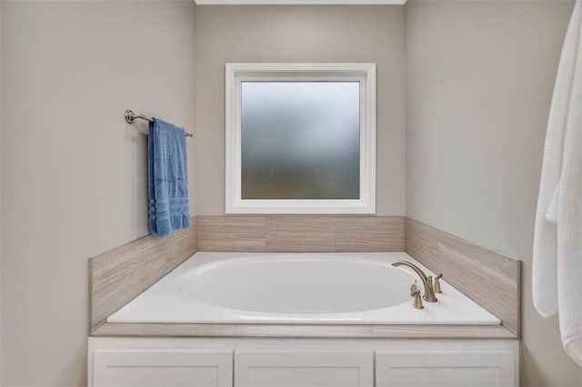 bathroom with a garden tub