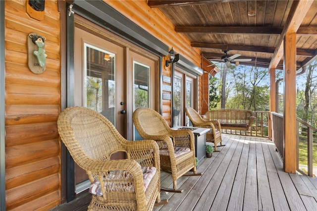 wooden terrace featuring french doors and ceiling fan