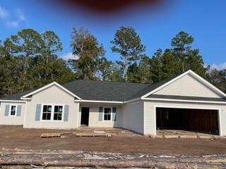 ranch-style home featuring a garage