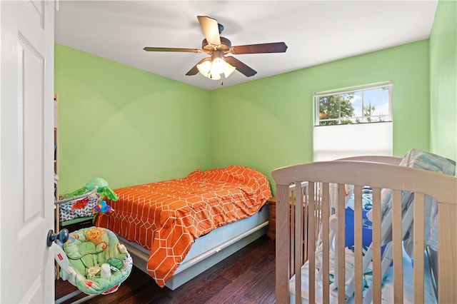 bedroom with a ceiling fan and wood finished floors