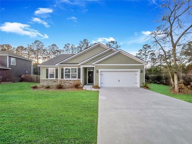 view of front of home featuring a garage, concrete driveway, and a front lawn