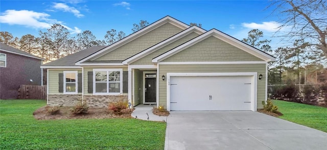 craftsman-style house featuring a front yard, an attached garage, brick siding, and driveway